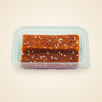 Coconut Jaggery Burfi pieces in a tray